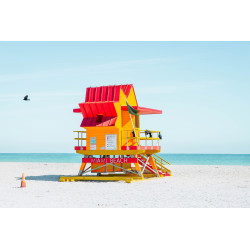Colorful Miami Beach lifeguard tower with blue sky.