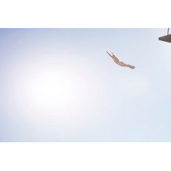 Woman diving from platform