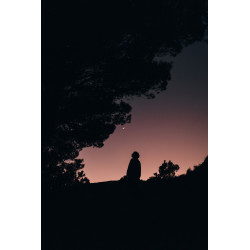 Silhouette of woman against clear night sky