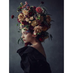 Thoughtful young woman in floral headdress