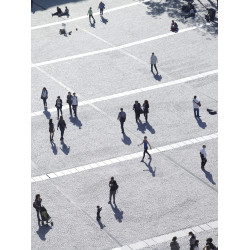 People walking across a plaza