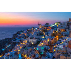 View of Oia in Santorini, Greece with sunset colors