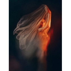 Serious redhead woman covered with white silk