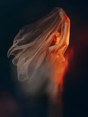 Serious redhead woman covered with white silk, 2021