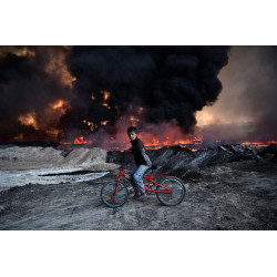 Boy and Burning Oil Field