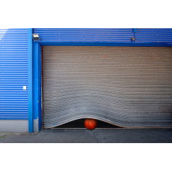 silver shiny rolling gate and baseball